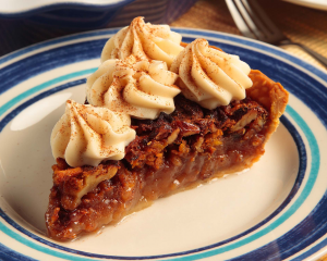 carrot cake pie on plate with whip topping